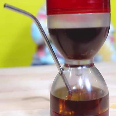 I design fake inventions and the Cocktail Hourglass helps you drink only one drink per hour.