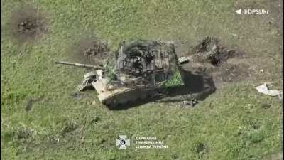 An abandoned Russian T-90M is destroyed by a Ukrainian FPV drone after it gets into the hatch (Bakhmut front, June 2024)