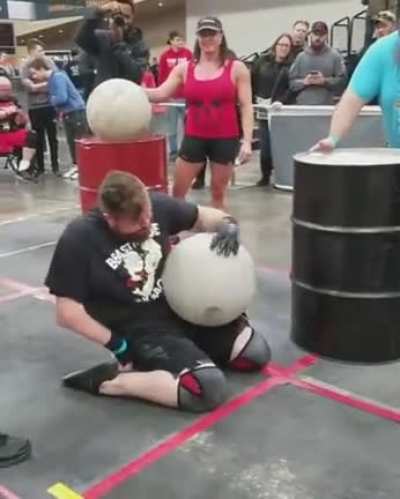 Handicapped man doing the Atlas Stones at Arnold Schwarzenegger’s Disabled Strongman competition
