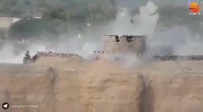 Afganistani Taliban attacking Pakistani Army base.