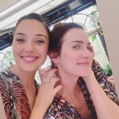 Gal tickling her friend's neck
