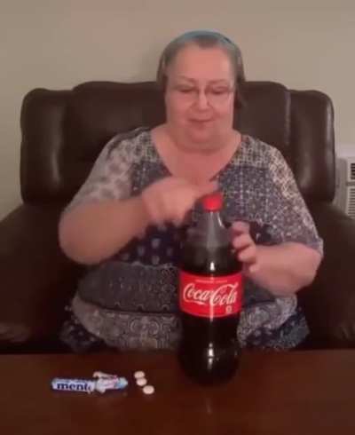 Woman tries the mentos-cola experiment