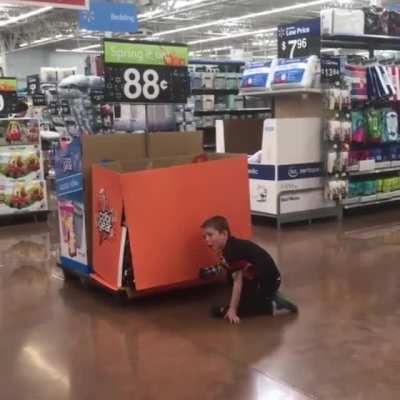 Kid tries to pick up bottles...