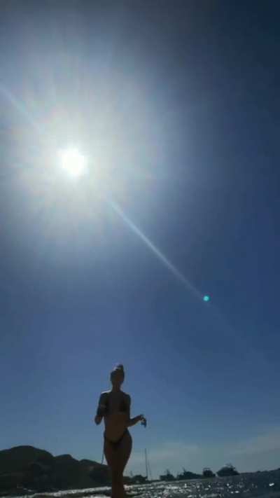 On the Beach in a bikini enjoying the sun