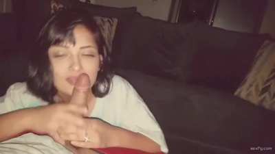 Sexy petite brunette gives a blowjob on her knees
