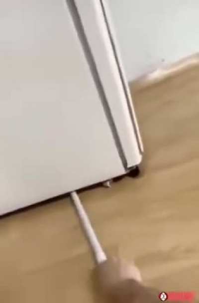 Cleaning under the fridge