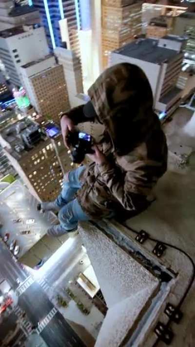 My friend @high_vis getting shots on a dallas roof [OC]