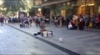 Bucket drummer gets rudely interrupted by a random idiot
