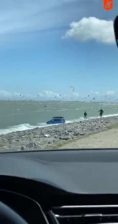 German tourists forget the handbrake when visiting the Dutch coast