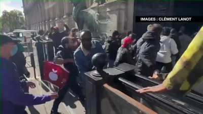 Migrants force their way into 