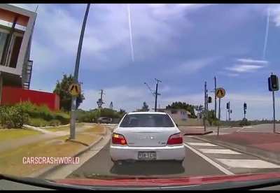 Driver randomly stops in intersection.