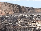 Throwing a trash bag in a volcano