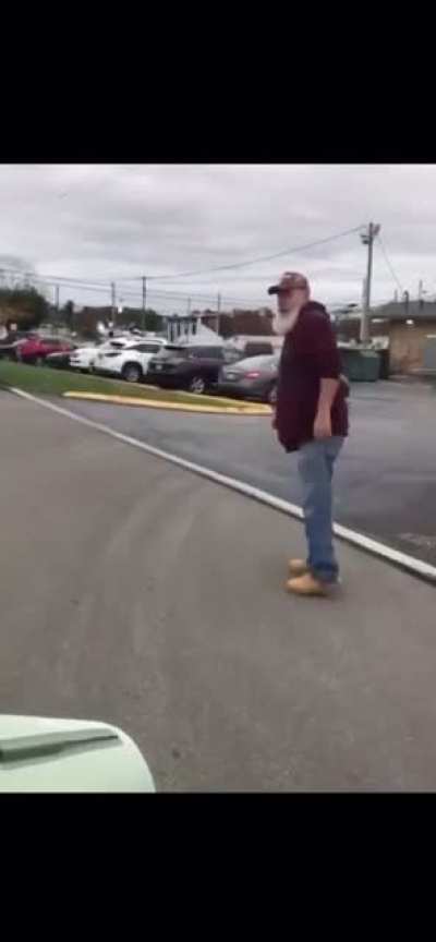 Racist Trump supporter repeatedly screamed the n word at a rally Saturday then proceeds to confront protestors and assault a veteran while they were trying to leave.