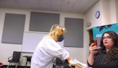 VCU, Virgina: Activist rush speakers podium at 'Students for Life' event.