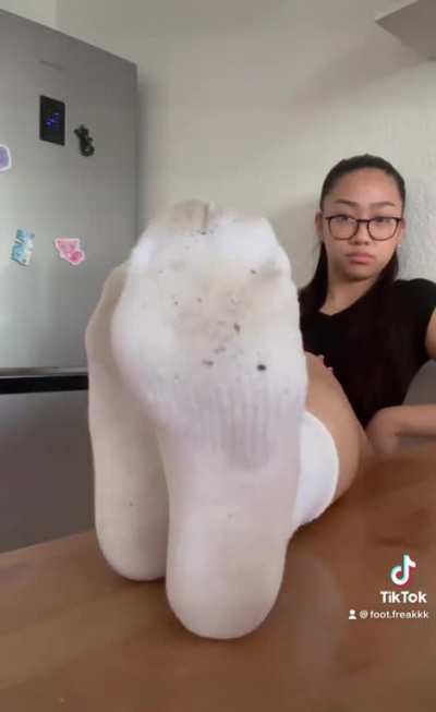 Asian TikTok Girl removes her shoes and socks