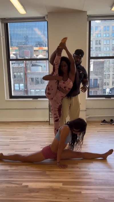 Sasha Banks and Naomi working with the stretch coach