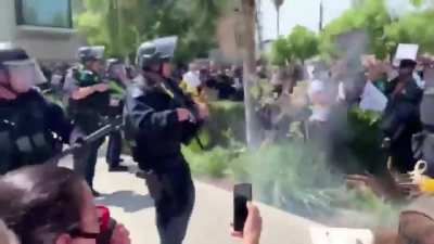 LAPD beating and shooting peaceful protesters for no reason.