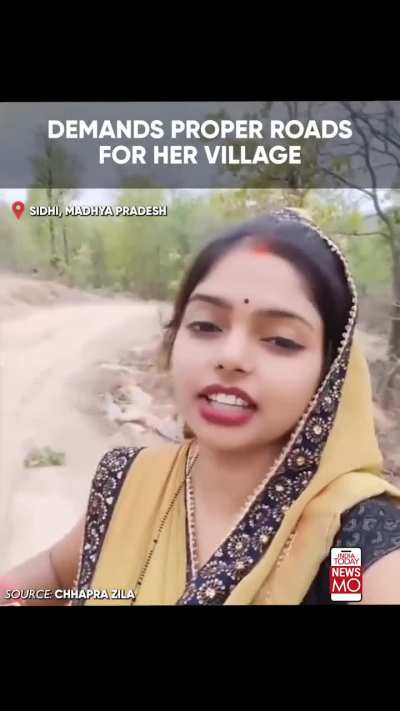 A woman urges PM Modi to build a road in her area, highlighting its poor condition despite complaints to local officials