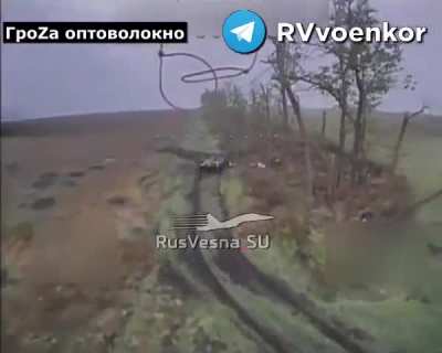 A Russian drone strikes a Ukrainian BMP- Kupyansk