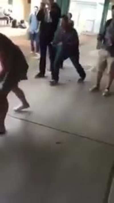 Girl in dress beats a coward up then runs away like Tom Cruise