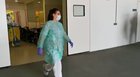 Cleaning staff girl receiving praise from doctors for her service; 
