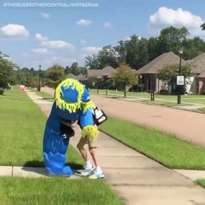 He greets his younger brother everyday after school by wearing a different costume each time.