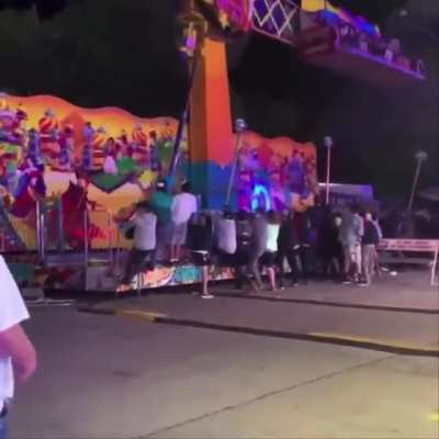 Bystanders at the Cherry Festival in Traverse City, Michigan rushed over to stop a carnival ride from tipping over