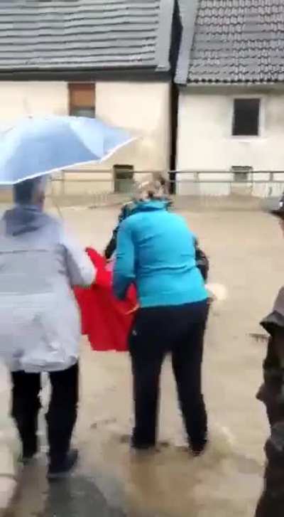 Quick Acting Germans Save A Firefighter From Torrent Of Flood Waters That Submerged City Streets