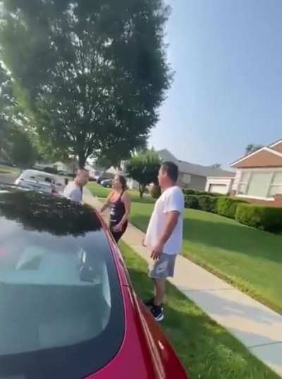 Off duty NYPD officer sits on man’s car and refuses to move as wife tries to reason with him