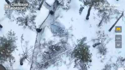 Ukrainian Border Guards of the “Steel Kordon” Offensive Guard Brigade hit a Russian dugout with drone dropped munitions causing the occupants to flee, one appears to drop their rifle and abandon it.
