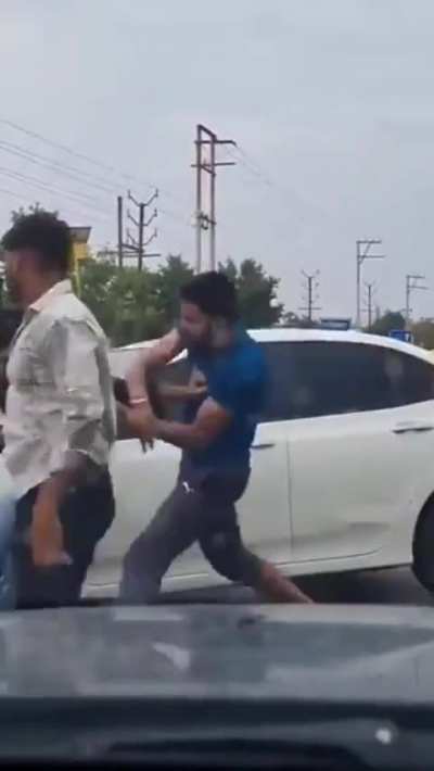 Car Interrupts Fight and Hits Two People