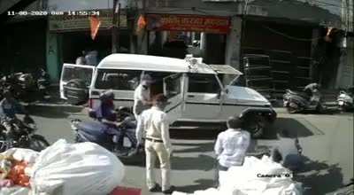 Cop in India opens door of his car and makes biker crash and then beats them up