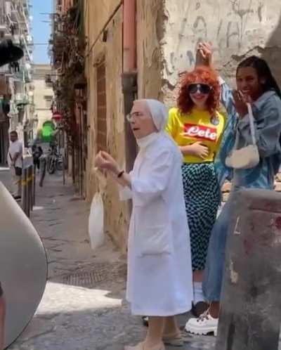 Nun pulls apart girls kissing during photo shoot in Naples