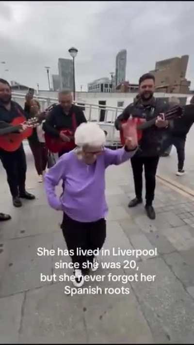 Lovely old lady gets to meet her favourite band..