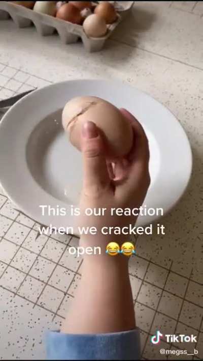 cracking open a big egg