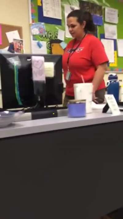 Student hides under desk and grabs teacher's ankle