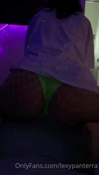 Shaking her ass in bed.
