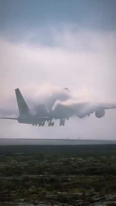 Airplane disappearing in a wall of clouds 