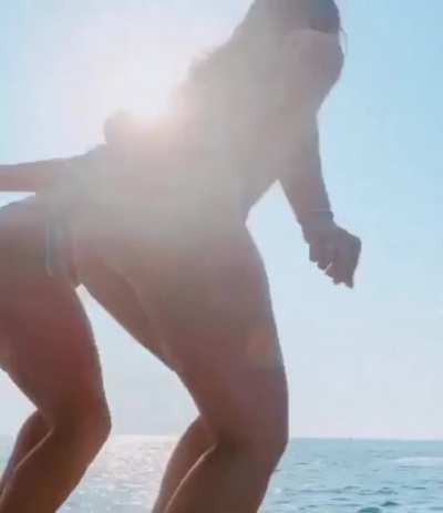 Natalie jumping off a boat