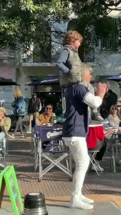 A young boy lost his dad in a crowd in Argentina. Strangers came together to help, chanting the father's name. Then the band joined in with a song, 