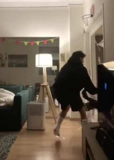 WCGW Basketball rim over a glass door