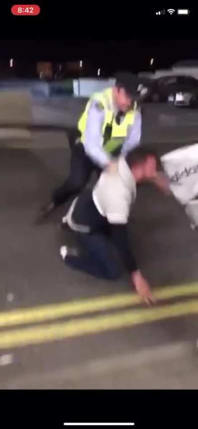 Pissing on a police car
