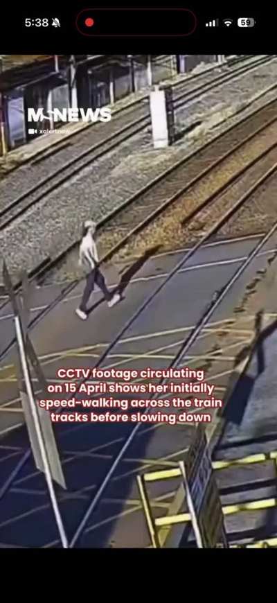 Woman in Brazil ignores warning from oncoming train