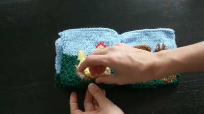 I designed and knit a touchable baby book for my coworker!