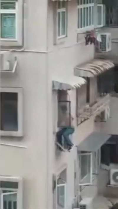 Guy fixing the AC