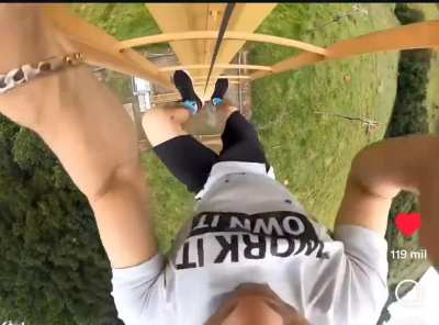 Man has to climb down a electric tower while being attacked by a swarm of bees