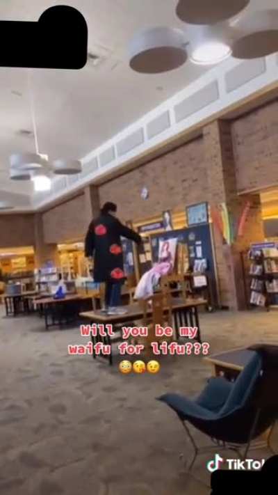 He proposed to his body pillow in a public library