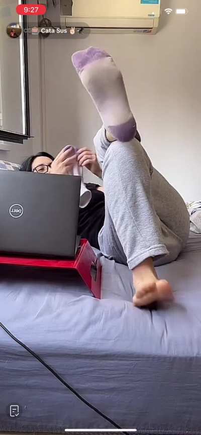 Sniffing her sock