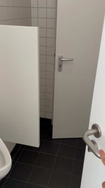 completly nude in a public bathroom