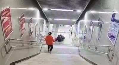 Preoccupied with Phone, Woman Takes Nice Tumble